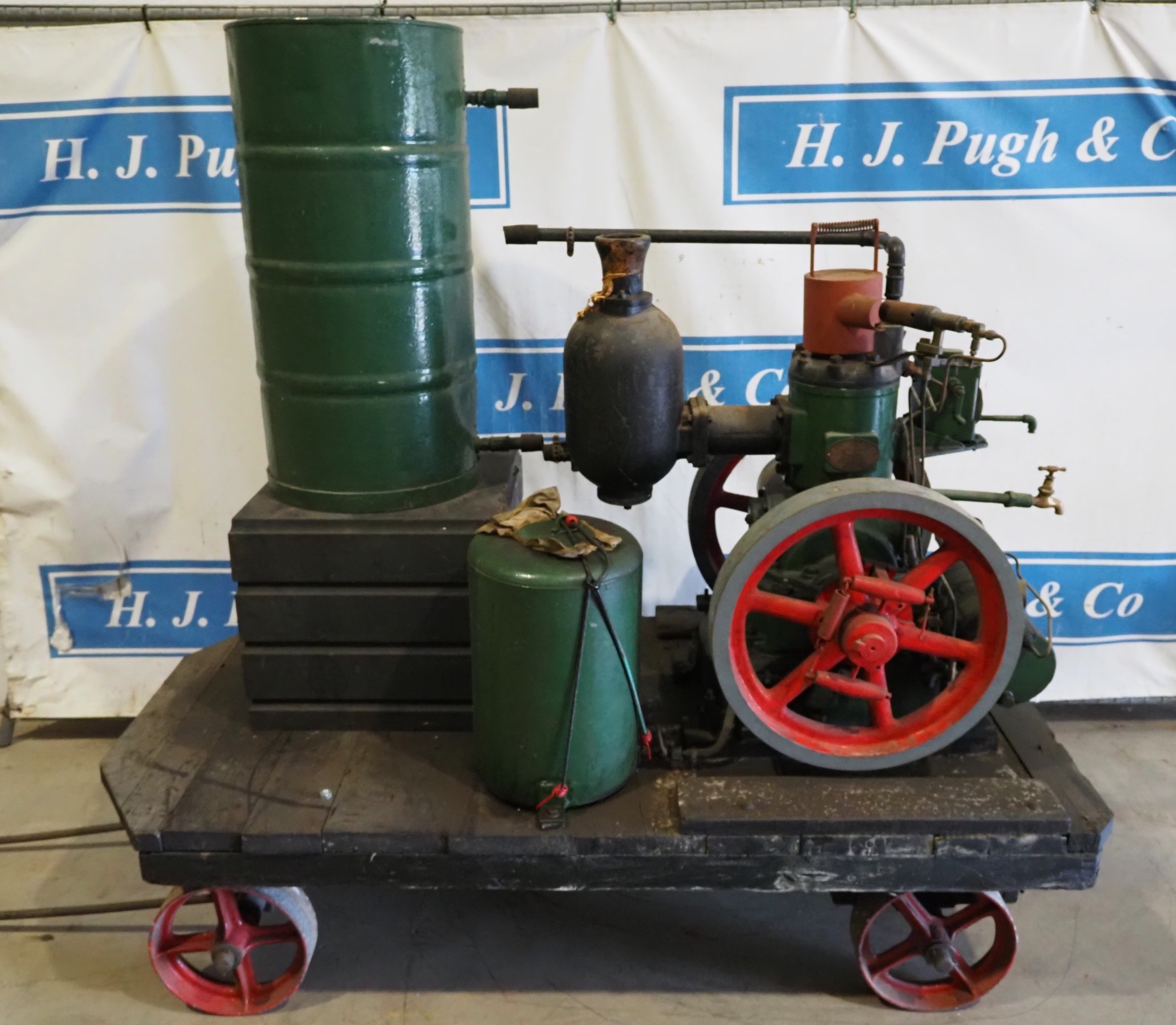 Hamworthy oil engine 4hp on trolley with water tank. Engine No. 27030