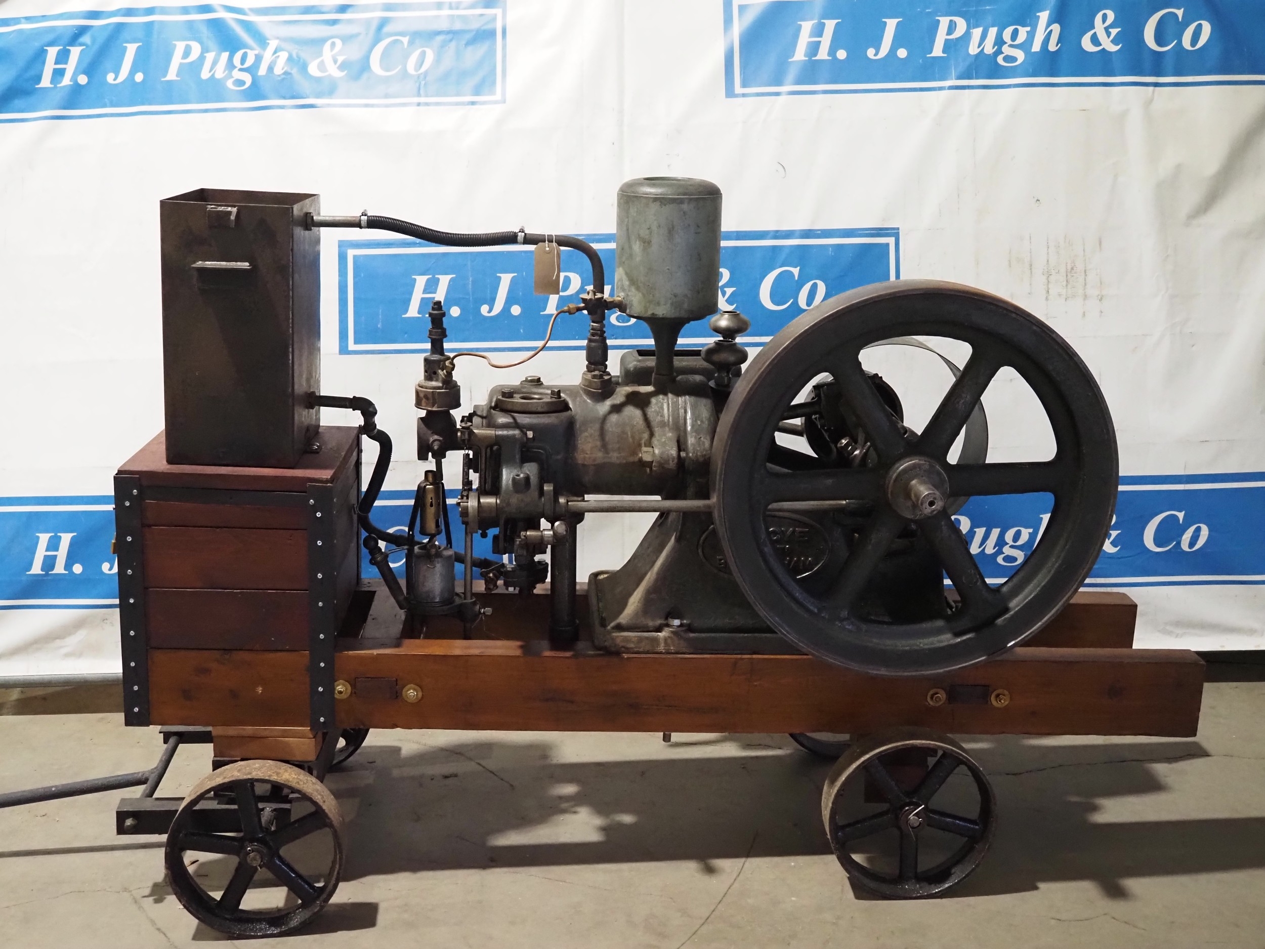 Tangye Hot Bulb engine compressor on trolley. C/w starting handle. No. 33212. Believed manufactured in circa 1902 and was possibly rebuilt in C. 1925. Operating book, photos, letters to and from Tangye expert, history and Tangye transfers in office